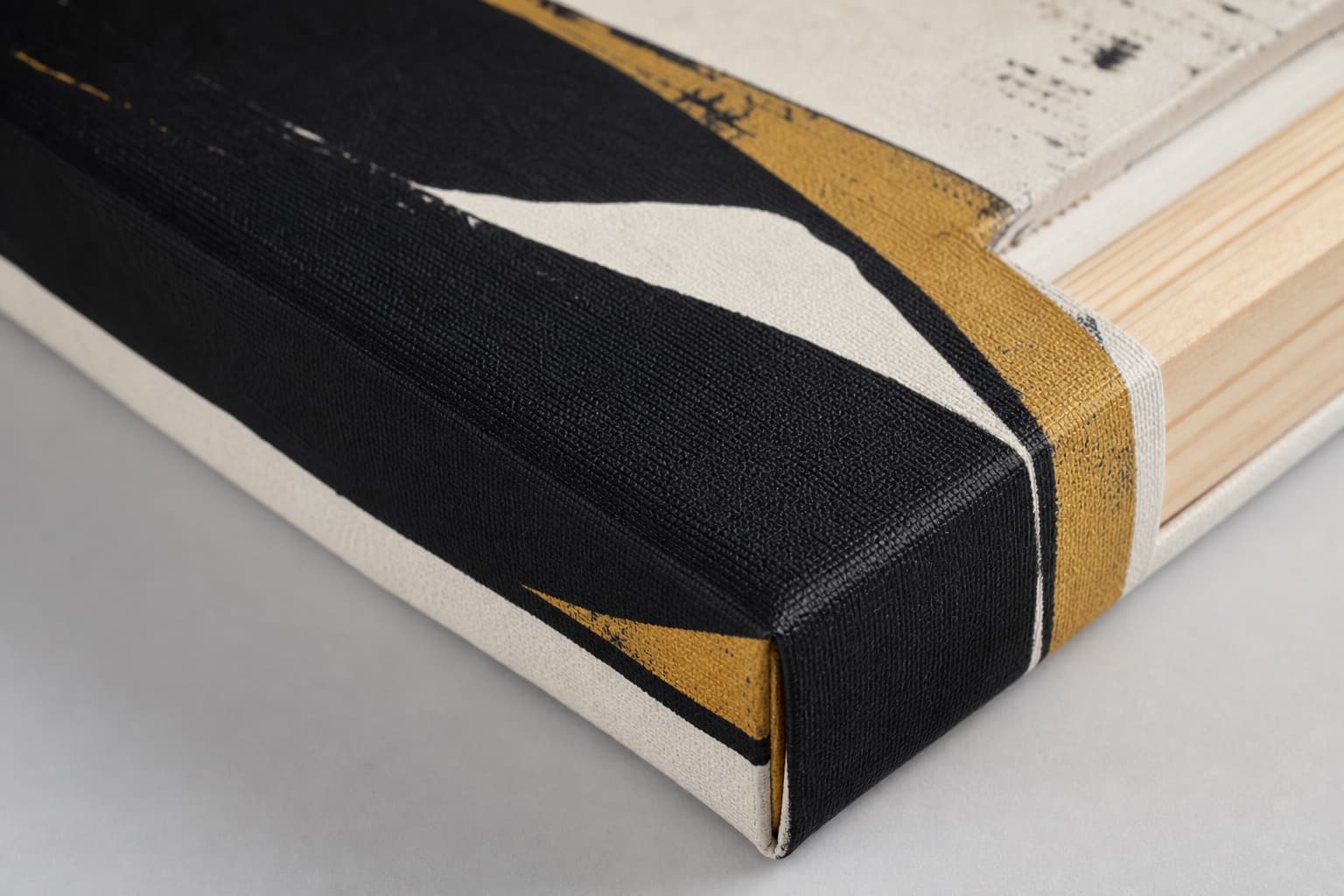 Macro detail of woven canvas texture and a clean gallery-wrapped corner